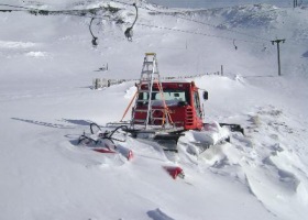 9-6-12 - The Edge groomer buried in snow at the base area