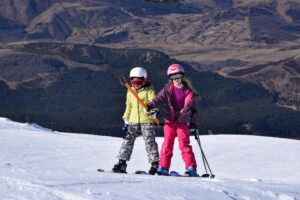 winter school camp two primary aged kids on tbar lift