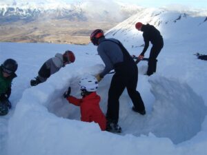 winter school camp building snow cave at Mt Cheeseman